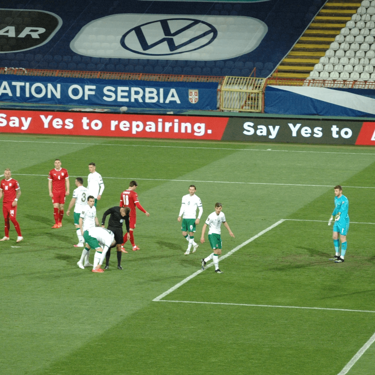 Football match with LED perimeter advertising in a stadium